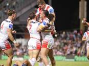 St George Illawarra players celebrate after scoring a try against the Warriors at WIN Stadium on Friday, April 19, 2024. Picture by Adam McLean