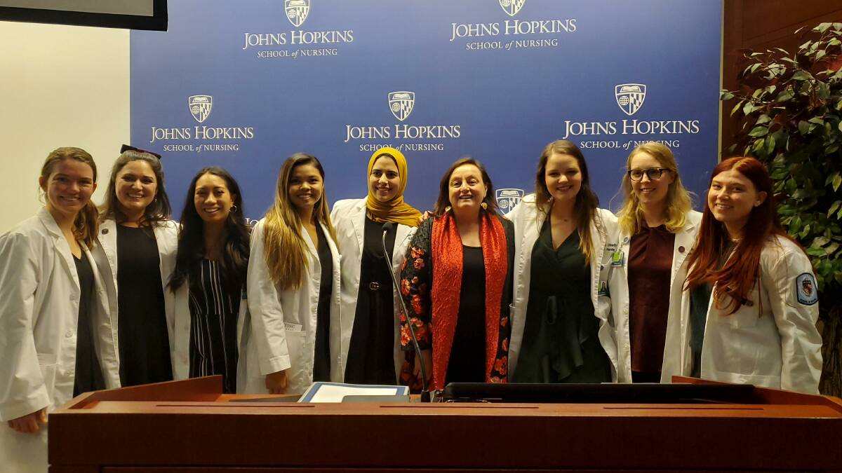INSPIRATIONAL: Professor Patricia "Trish" Davidson (red), the Dean of the School of Nursing at Johns Hopkins University, with students.