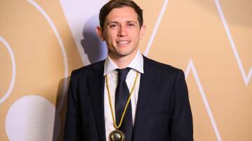 Craig Goodwin with his Johnny Warren Medal at the Dolan-Warren awards night in 2023. Picture by Getty Images
