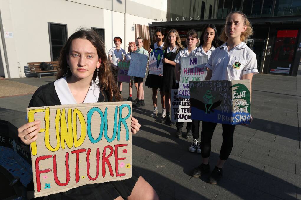 SIGN OF THE TIMES: Wollongong teenager Ella Lee and other students supporting the School Strike 4 Climate Australia day of action on September 25. Picture: Robert Peet