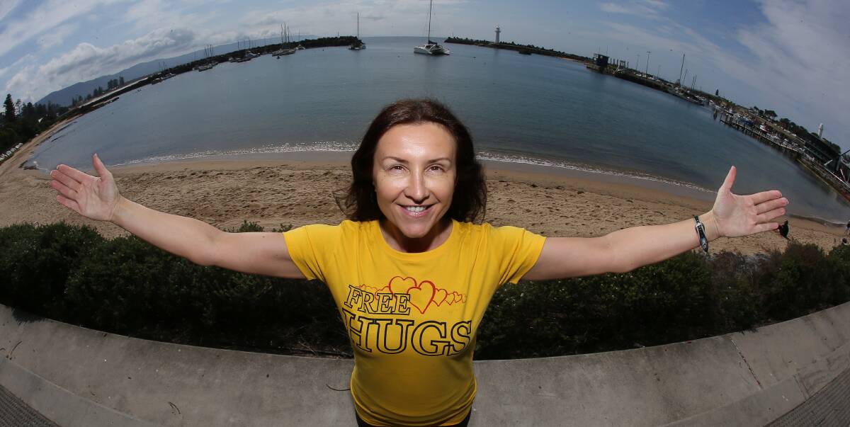 OPEN ARMS: Dee Milenkovic is ready to give hugs to one and all on Thursday, September 8 for R U OK? Day. She is hosting a Hug-a-thon at the Wollongong Harbour precinct from 7-10am. Picture: Robert Peet
