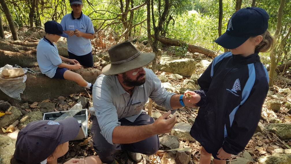 Illawarra EEC teacher Steve Leake with some local school students in the rainforest at Killalea State Park. Picture; Supplied.