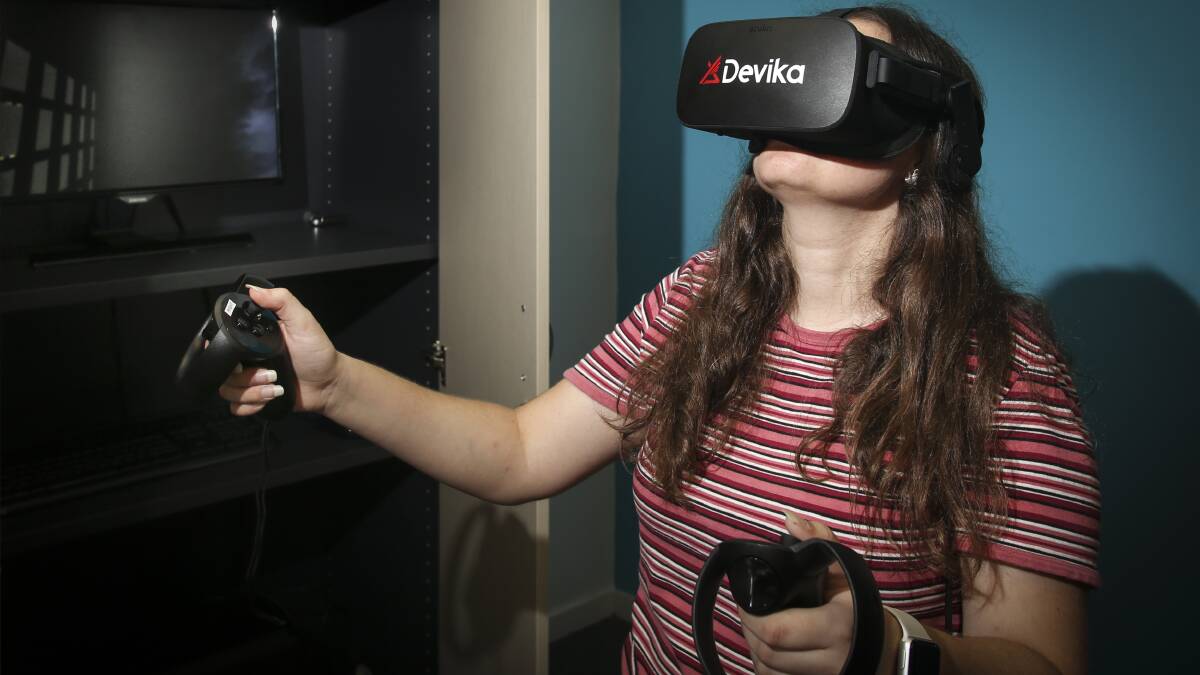 NEW HUB: Isabella Madry trials the new virtual reality sensory room at The Disability Trust's new premises in North Wollongong. Picture: Anna Warr