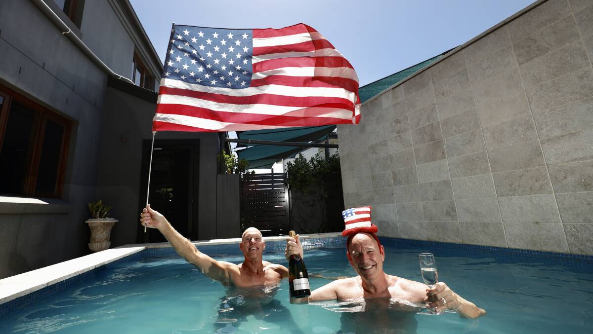 CELEBRATING: Dean Grant and Bill Brock took to the pool to celebrate the inauguration of Joe Biden as US president. Picture: Adam McLean