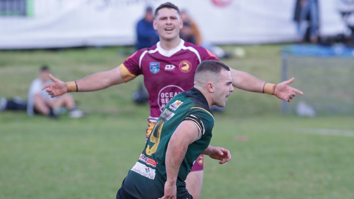 Stingrays hooker Colby Smith celebrates scoring much to the frustration of his Sharks opponent. Picture by Adam McLean