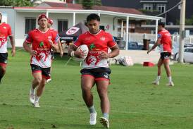Michael Molo and his St George Illawarra team-mates training in Wollongong on Monday ahead of their season opener away to the Gold Coast Titans on Saturday night. Picture by Robert Peet