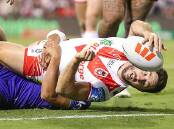 Ben Hunt reached out to score the Dragons third try in St George Illawarra's 30-12 win over New Zealand Warriors on Friday night at WIN Stadium. Picture by Adam McLean
