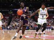 SIGNING: The Illawatta Hawks have finally got one over the Sydney Kings, snaring championship winner Wani Swaka Lo Buluk to the club. Picture: Getty images.