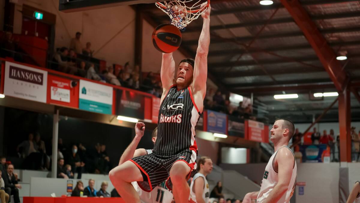 BEAST MODE: Lucas Walker dunking, will miss the Hawks clash against Bankstown Bruins on Saturday. Picture: Joel Armstrong