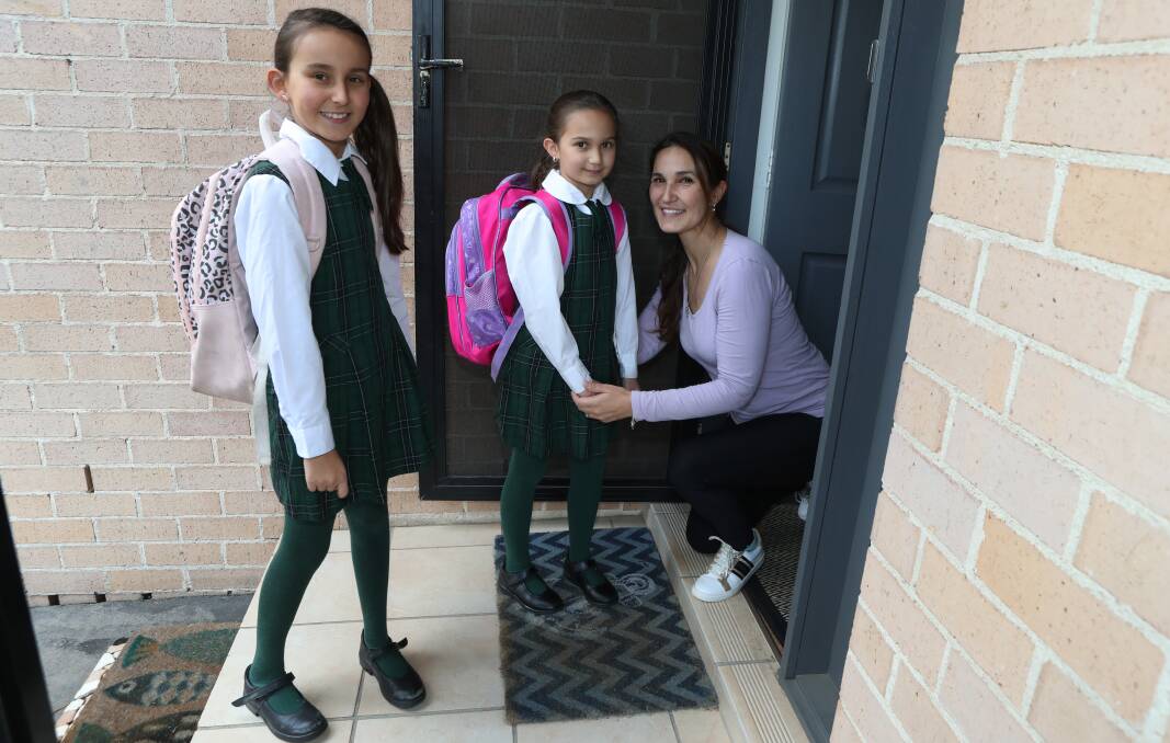 CONCERNED BUT RELIEVED: Rita Jaksic said daughters Jacinta Jaksic, 9 and Gianna Jaksic, were looking forward to heading back to Stella Maris Catholic Primary School. Picture: Robert Peet