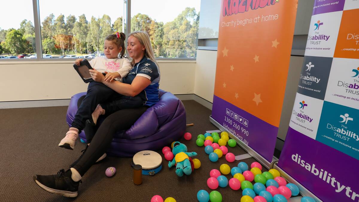 CONNECTING: Grace Fongaro with The Disability Trust staff member Taylah Gartshore. Picture: Adam McLean