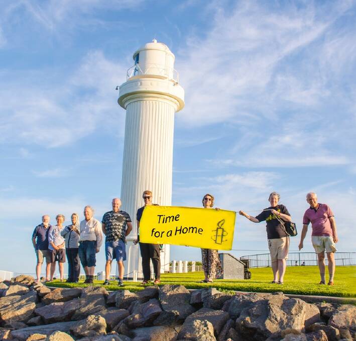 SUPPORT: Amnesty International Wollongong members at Wollongong Lighthouse call for a permanent resettlement solution for asylum seekers.