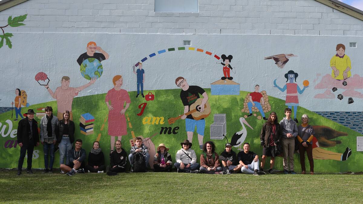 The Disability Trust clients in front of the 'We are Us' mural at MacCabe Park they helped design. Picture: Robert Peet