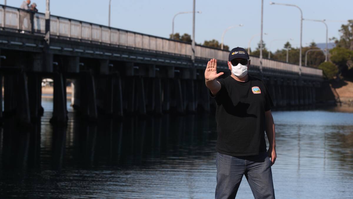 BACK OFF: South Coast Labour Council secretary Arthur Rorris pictured at Windang Bridge, which borders Wollongong and Shellharbour. Mr Rorris is unhappy Wollongong doesn't enjoy regional status like its neighbour Shellharbour. Picture: Robert Peet
