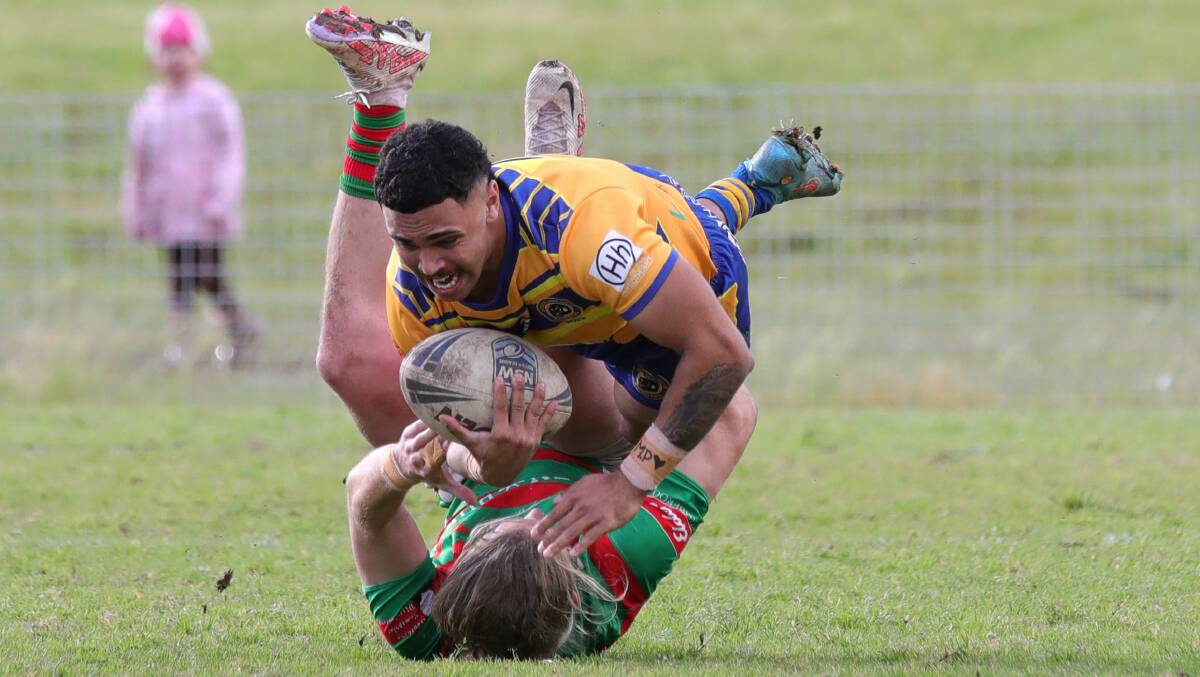 Tyrone Roberts tackled by a Jamberoo opponent. Picture by Sylvia Liber