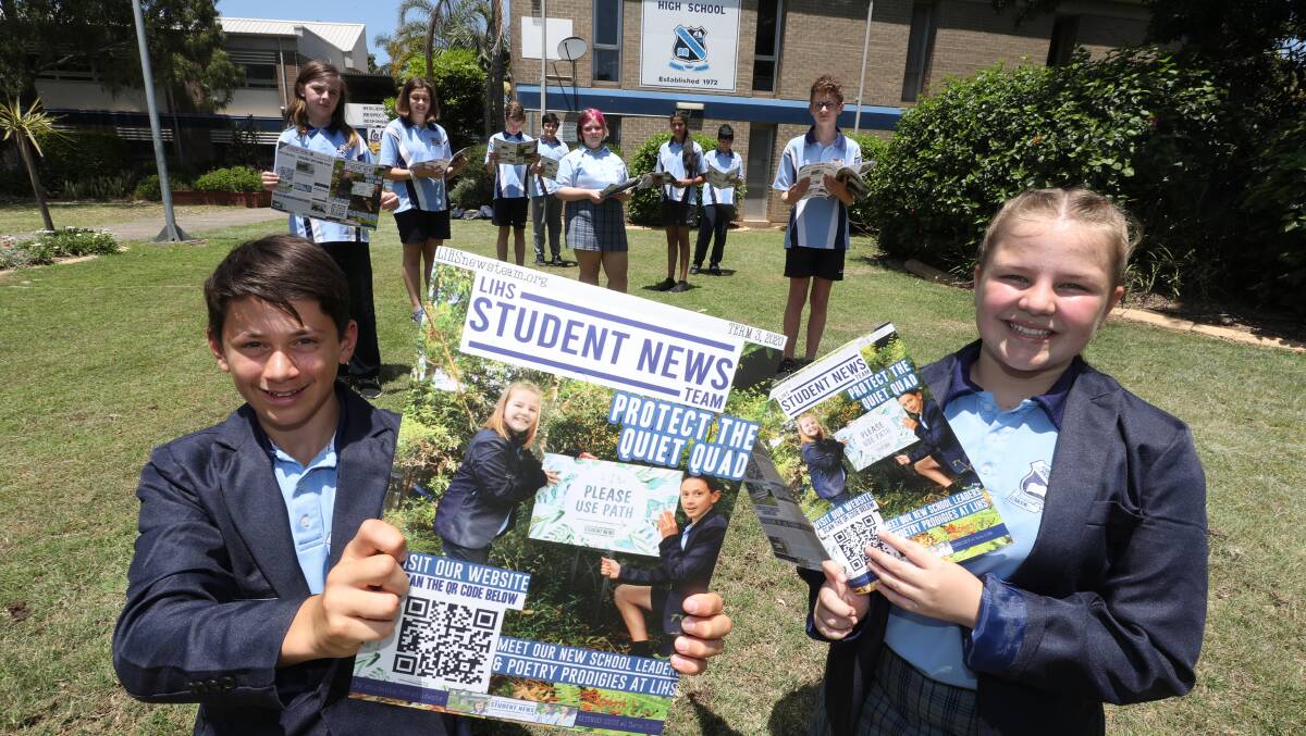 SUCCESS: Student News Team captains Chae Conte and Tori Henderson with the Lake Illawarra High School news team outside the school. Picture: Robert Peet.