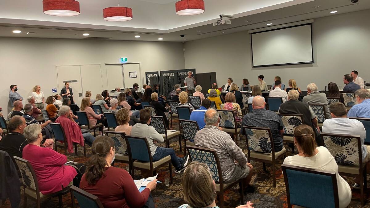 HEATED: About 100 people showed up to Tradies Helensburgh on Monday night to speak against a proposed Liquorland store in Helensburgh.