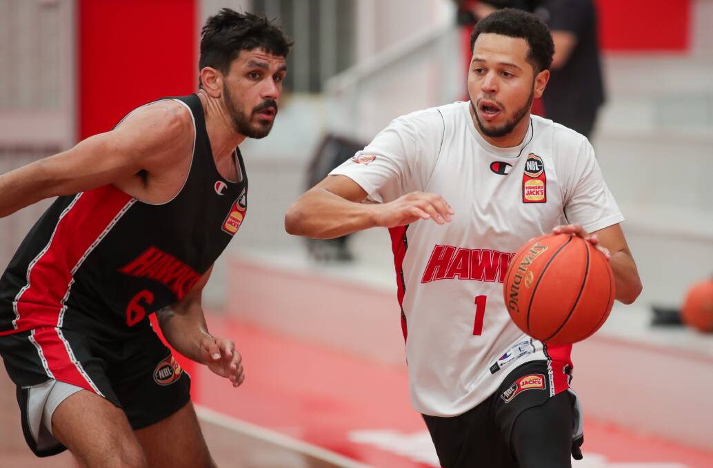 Will Hickey trying to defend Tyler Harvey in training this week. The duo were among the Hawks best players in their last-start 83-82 loss to Sydney Kings. Picture: Adam McLean