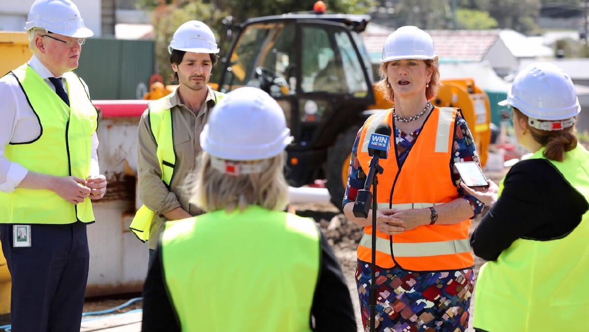 AT WORK: Housing Trust CEO Michele Adair (orange vest) wants the government to address the rental housing crisis in Tuesday's budget.