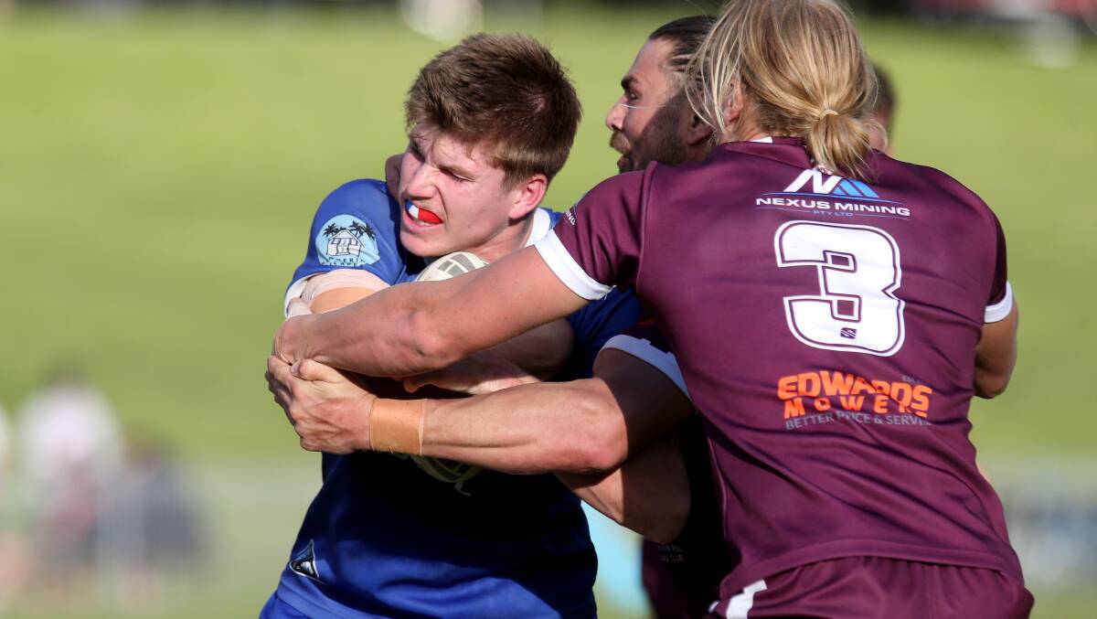 Albion Park-Oak Flats Eagles players wrap up Gerringong Lions second-rower Jack Quine. Picture by Sylvia Liber