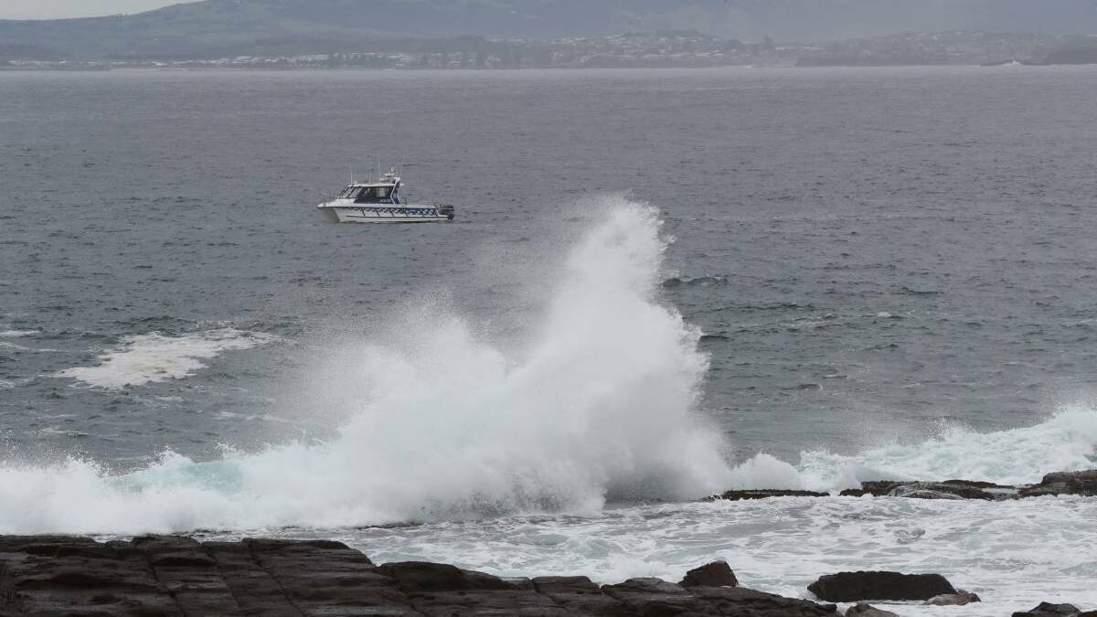 On April 28 vessels searched near Port Kembla beach for a missing fisherman. Picture:Robert Peet
