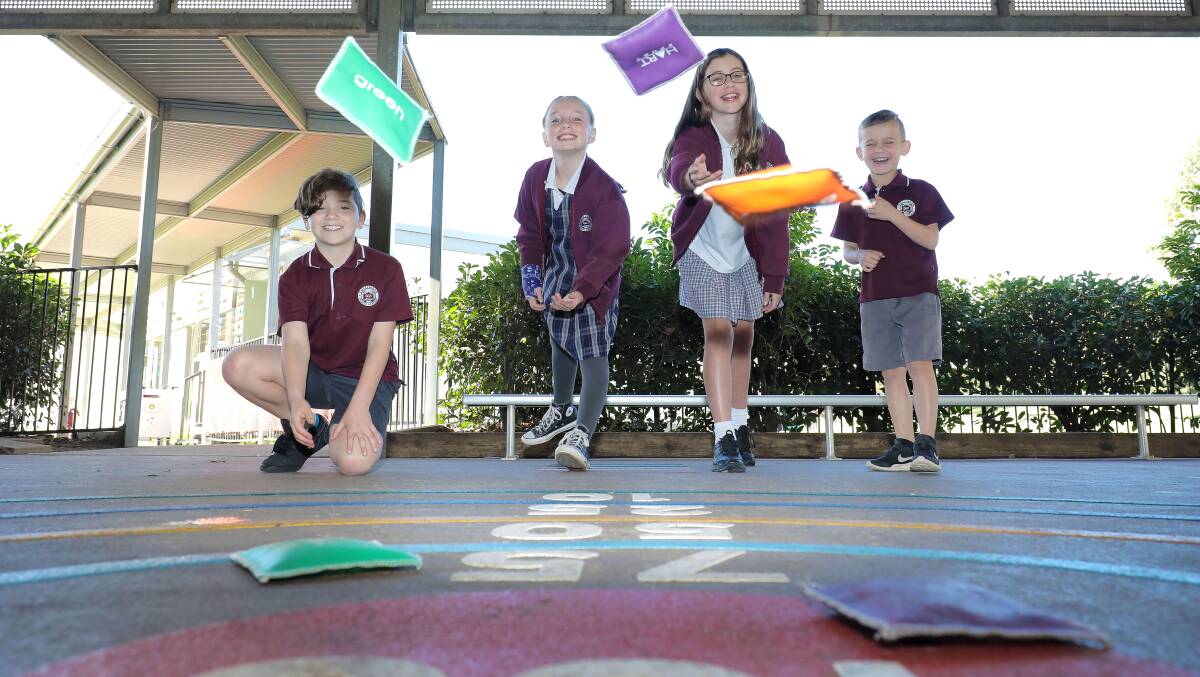 FUN TIMES: Tullimbar Public School students Kaelan Shipman, Zali Milthorpe, Emily Daly and Daniel Oldbury enjoy playing in the new interactive play spaces. Picture: Supplied.