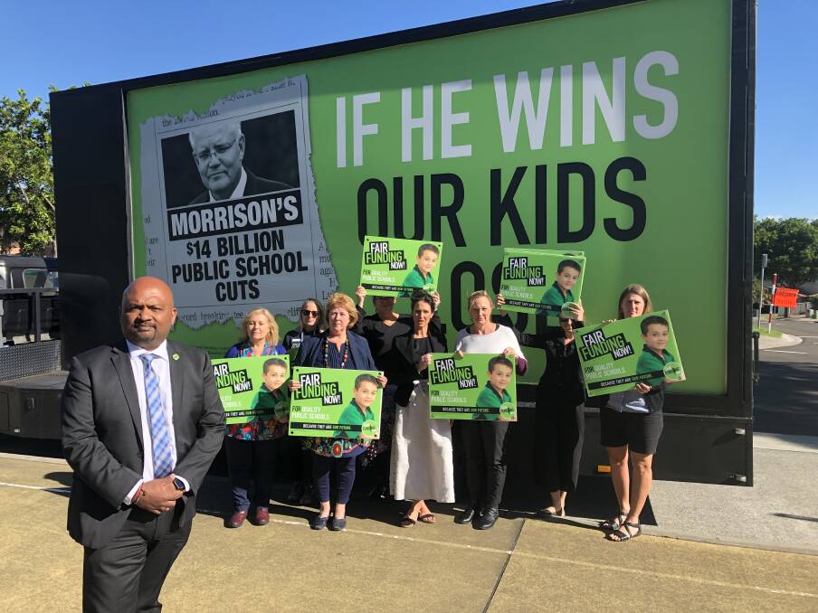 NSW Teachers Federation acting deputy president Henry Rajendra and Fair Funding Now! supporters at Flinders Public School on Wednesday.