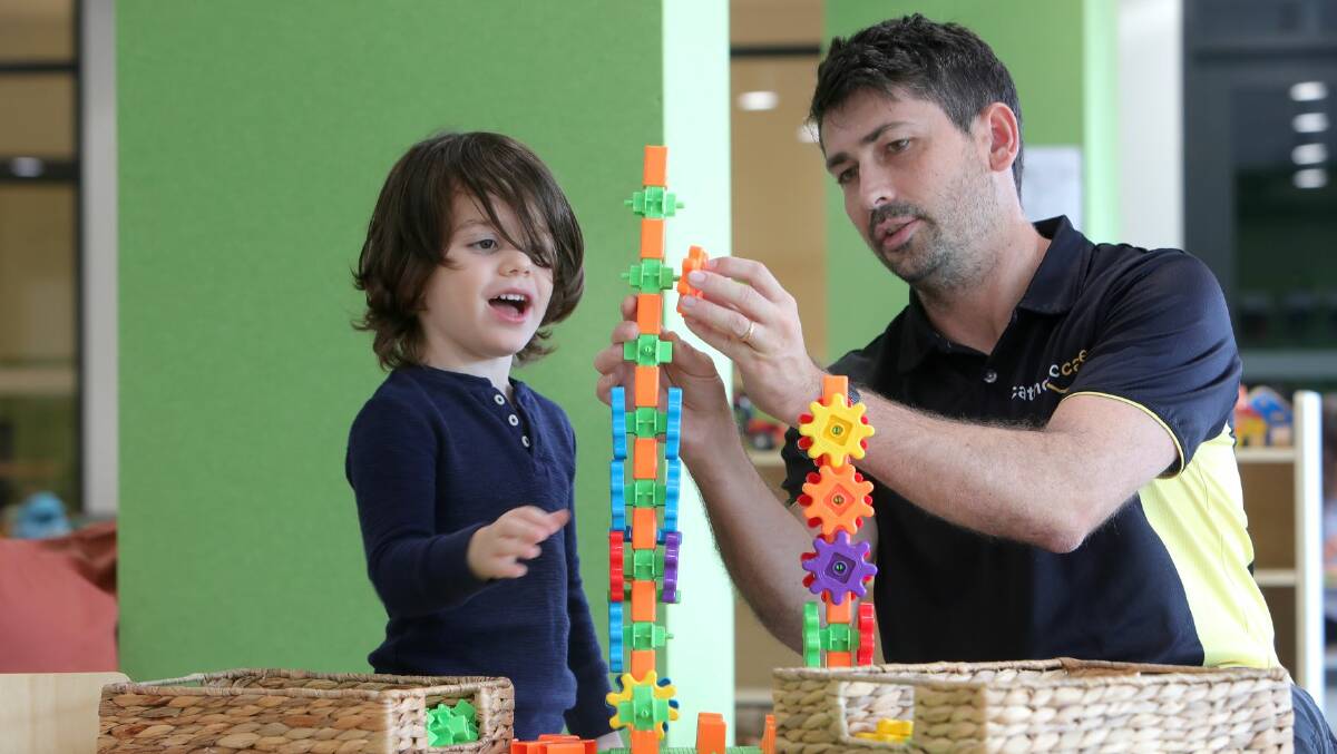 NEW VENTURE: CatholicCare Early Learning Centre director To Clark with Xavier in the new Shellharbour centre. Picture: Sylvia Liber