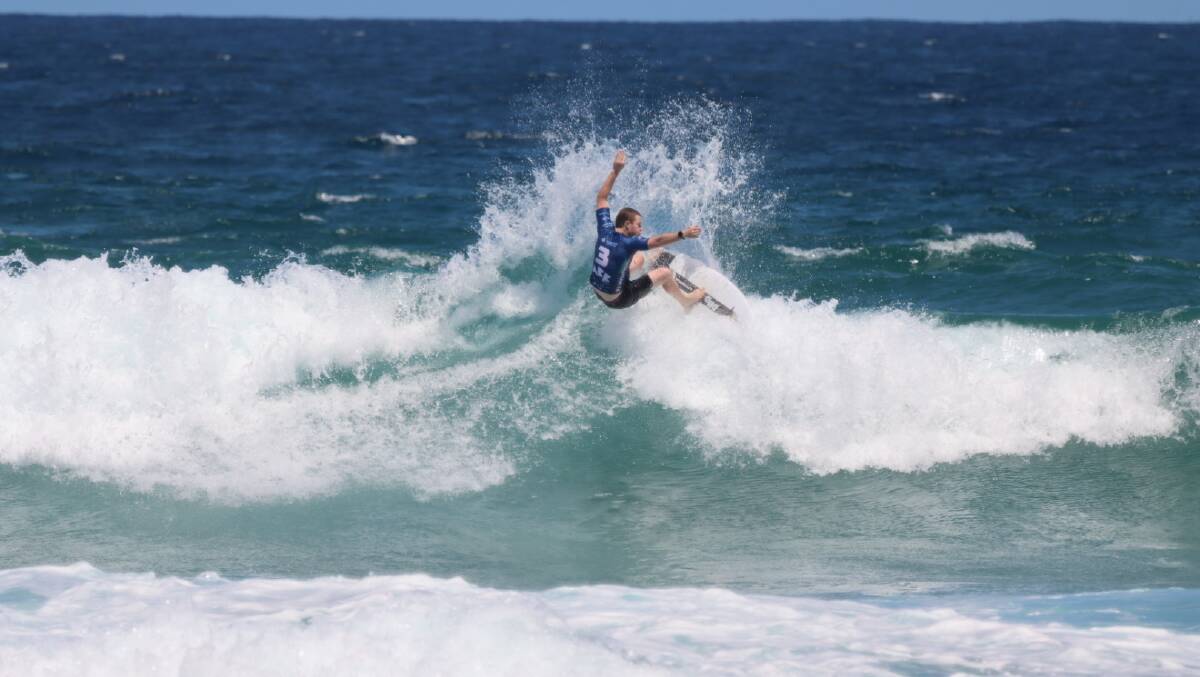 Jones Beach Boardriders Club surfer in action in Newcastle. Picture: Bob Willetts
