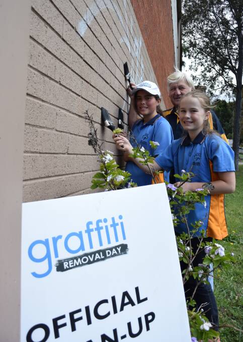 Cleaning up: Dapto Rotarian Mick Chamberlain and Dapto Girl Guides Chelsea Bevan and Taleah Hubbard will participate in Graffiti Removal Day. Picture: AGRON LATIFI