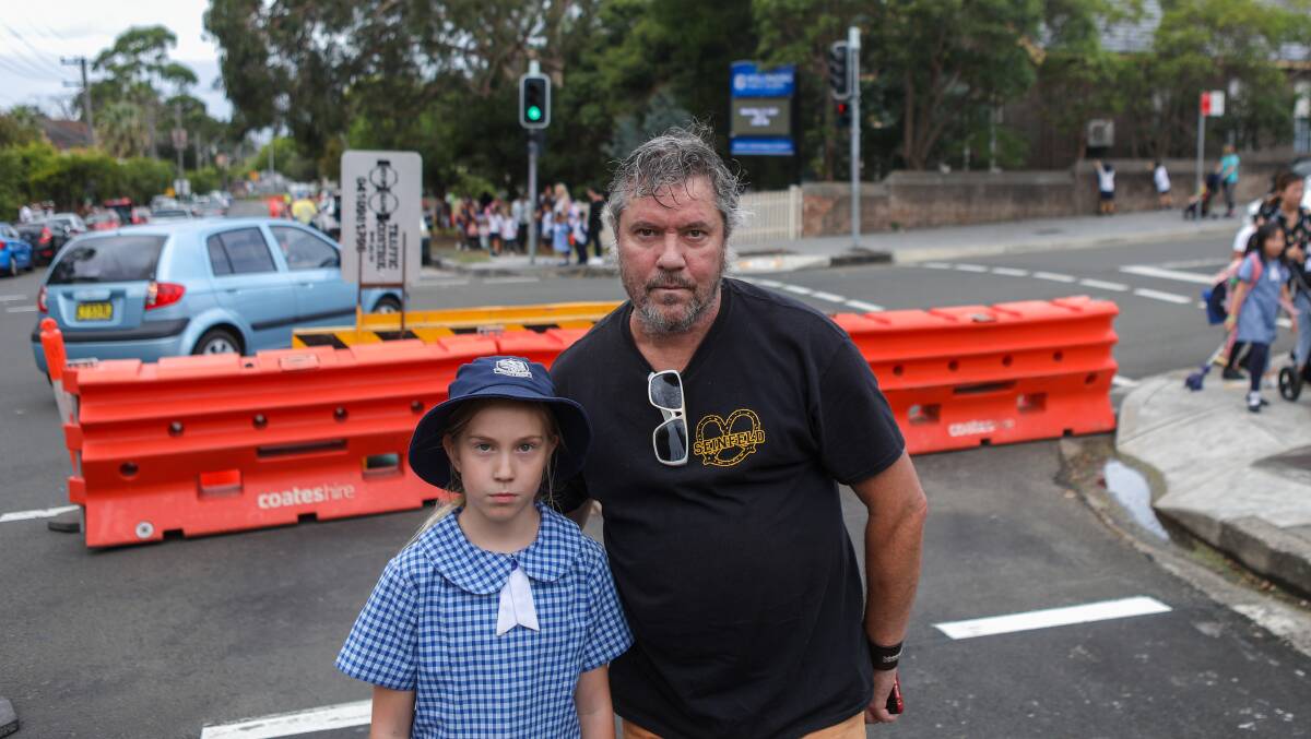NOT HAPPY: John Connors, with daughter Halle Connors, is not happy Smith Street is being turned into a one-lane street. Picture: Adam McLean