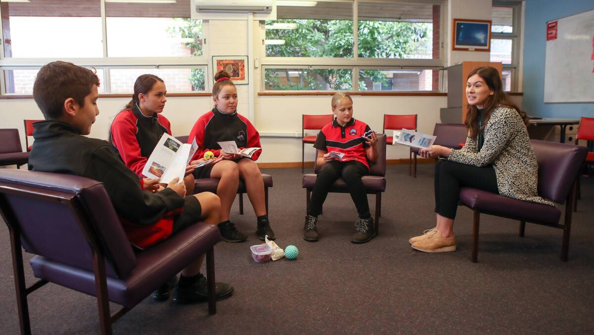 IN SESSION: Warrawong High School year 7 students Mateja Miovic, Milica Radosevic, Sienna Francisco and Myleigh Coelho with head wellbeing teacher Amanda Daenell. Picture: Adam McLean