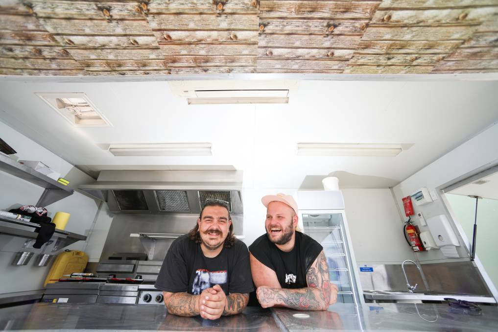 Foodie treat: Andrew Juskiw and Barry Pearson in Hank's Fried Chicken van in front of Fairy Meadow's Principal Brewing. Picture: Adam McLean.