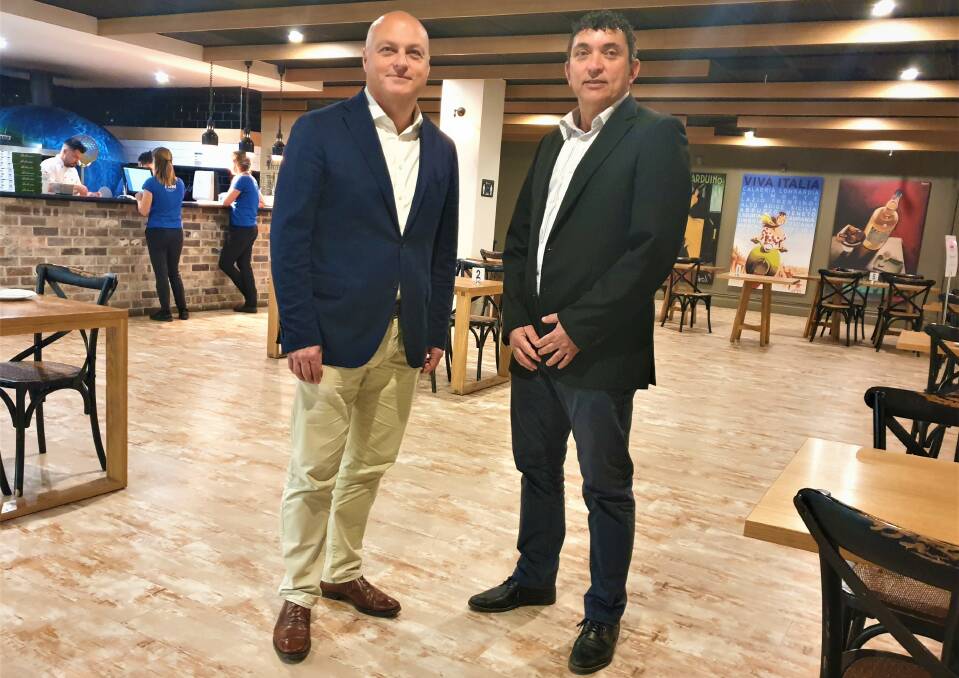 RECONNECT: University of Wollongong Deputy Vice-Chancellor Alex Frino, pictured with Fraternity Club chairman Mick Cudo, has joined the Fairy Meadow-based club's board.