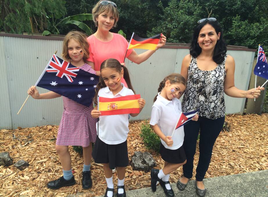 HARMONY: Tessa Bannister (9), sisters Angelique (7) and Amelie Salvador (6) with their mothers Nicole and Gretel. The sisters are attending Spanish classes at Balgownie Public School and Tessa, who speaks German, also learns Spanish at Mount St Thomas Public School.
