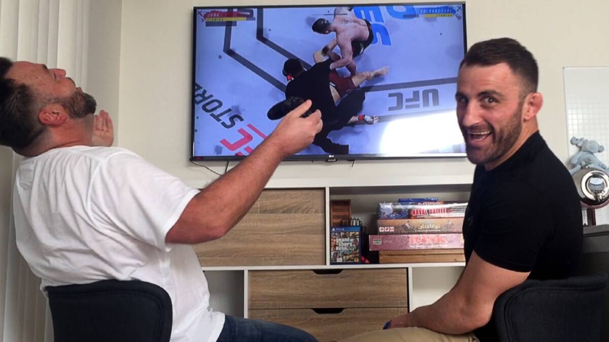 OH THE PAIN OF DEFEAT: Like in real life, UFC Featherweight world champion Alex Volkanovski proved too good for Mercury reporter Agron Latifi in their virtual UFC fight. Picture: Robert Peet