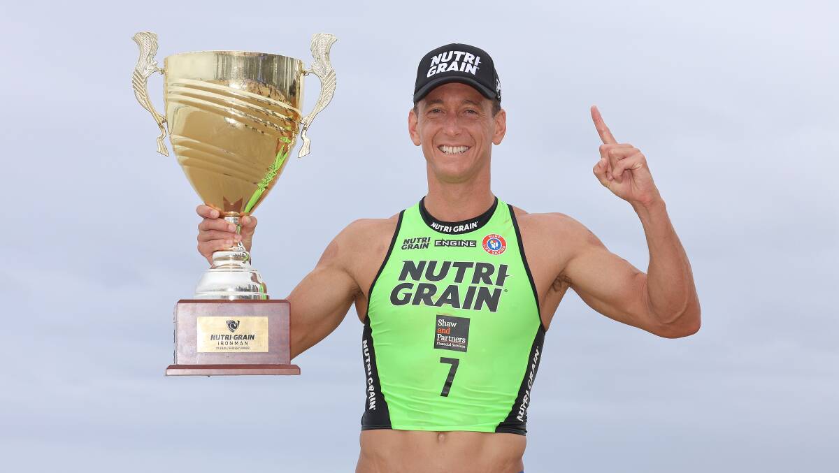 Ali Day holds aloft the trophy after winning his fifth Nutri-Grain Ironman Series. Picture by HarvPix