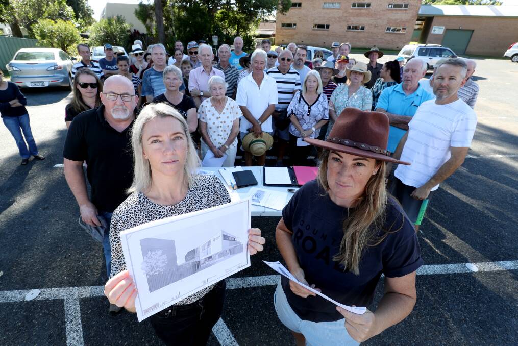 ANGRY: Lee Sanchez and Dayna Fensom with concerned residents at the site of the proposed child care centre development in Woonona. Picture: Robert Peet