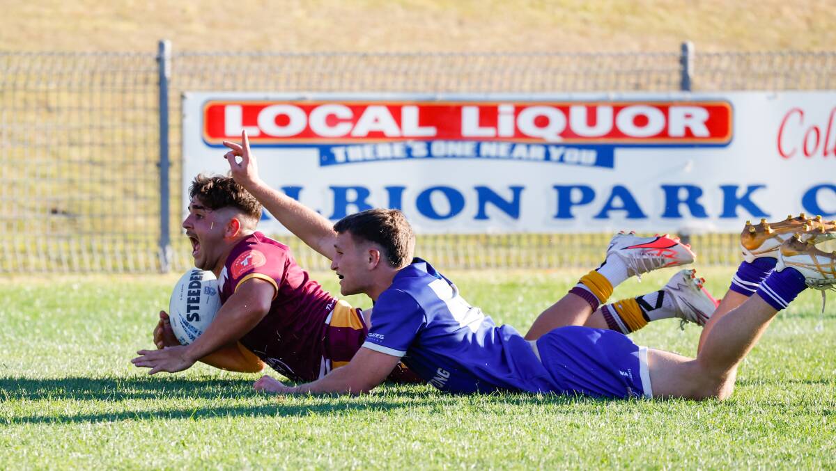 Isaac Morris crosses for a Shellharbour Sharks try. Picture by Anna Warr