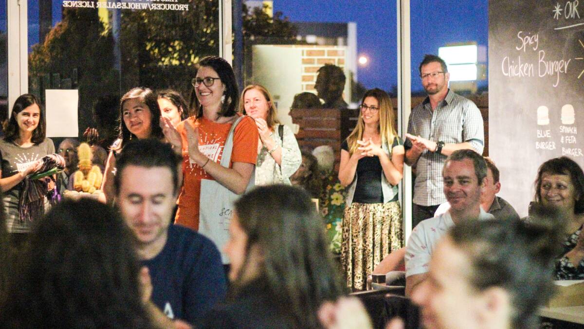 SCARF CEO Pippa Rendel (orange top) at last year's fundraiser at Five Barrel Brewing.