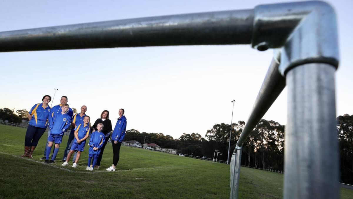 HAPPY: Natalie Rachlewicz, Lewis Rachlewicz, Antony Field, Kynan Sulcs, Ashley Sulcs, Hendrix Sulcs, Anna Watson and Michelle Sulcs show off new fence at Lakelands Oval. Picture: Adam McLean