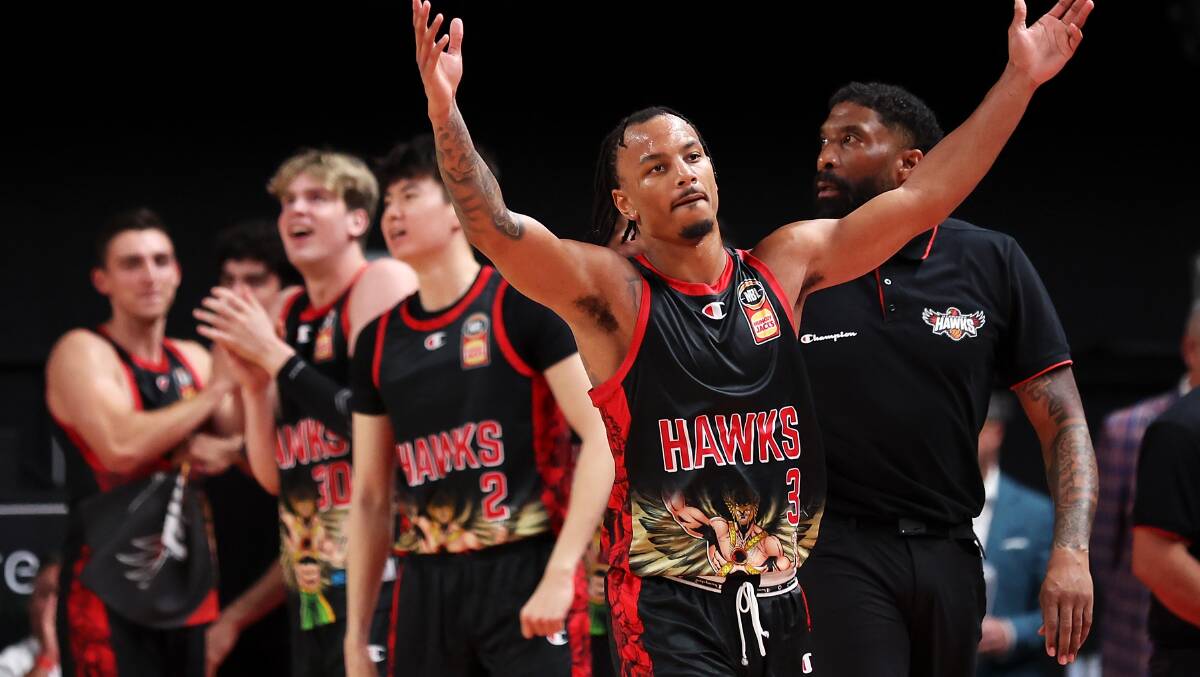 Illawarra Hawks guard Justin Robinson celebrates with the fans after the team's victory over the Perth Wildcats at WIN Entertainment Centre on Friday, December 8. Picture by Mark Kolbe/Getty Images