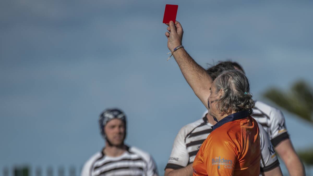 Paul Chambiras issues a red-card to a second-grade Kiama player during their clash against Shamrocks. Picture by Linda Faiers