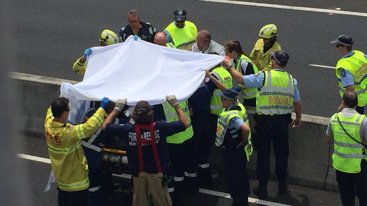 Motorbike rider crashes into barrier, flown to hospital with serious injuries