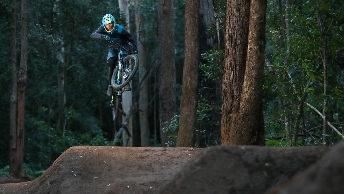 Michael Thompson riding the Possums mountain bike track in the foothill of the Illawarra escarpment at Tarrawanna. NPWS have plans to flatten the jumps on the track. Picture: Adam McLean