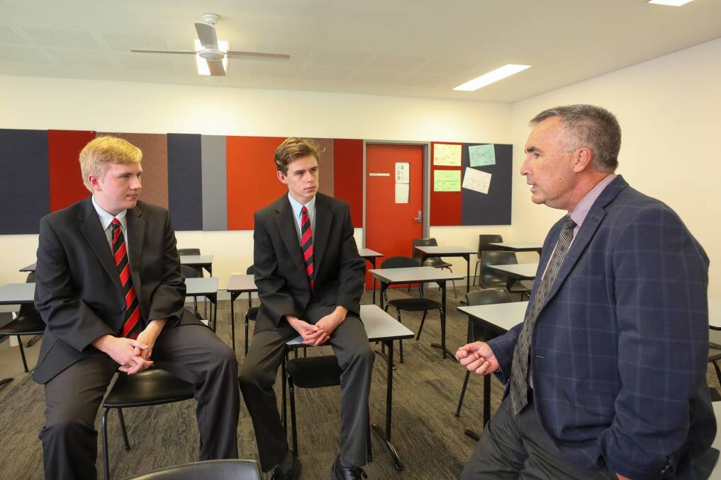 STUDENT-LED: Edmund Rice College principal Stephen Gough with Joseph Barron and school captain Benjamin Johnston. Picture: Adam McLean