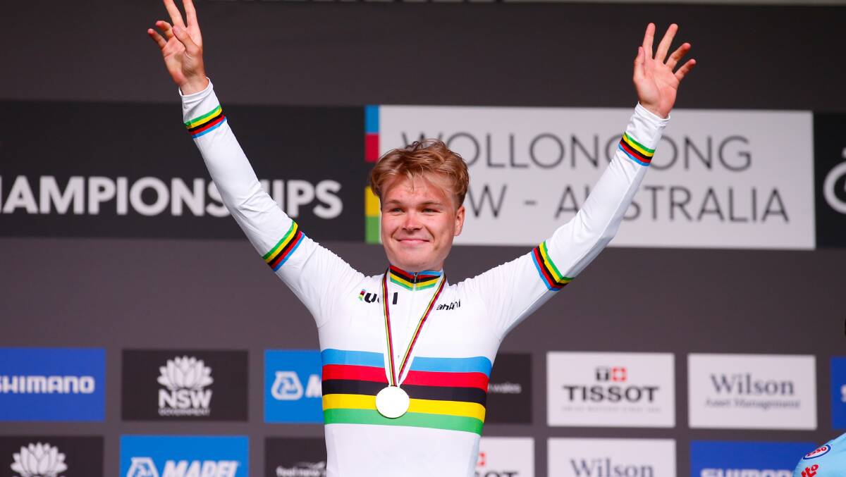 Norwegian cyclist Tobias S Foss celebrates after winning the UCI Road World Championships men's time trial in Wollongong on Sunday. Picture: Anna Warr