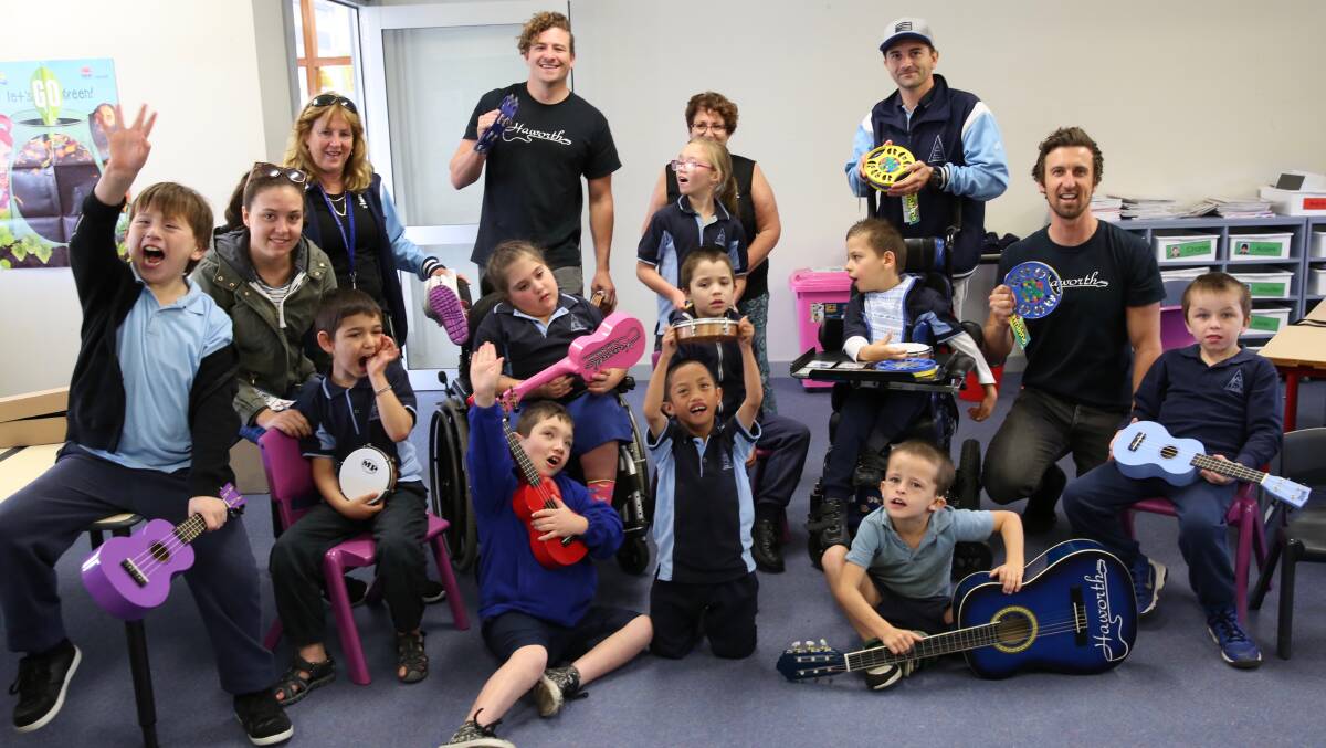 MUSICAL GIFTS: The team from Haworth’s Shellharbour Music Centre dropped into Peterborough School in Warilla to donate musical instruments. Picture: Supplied