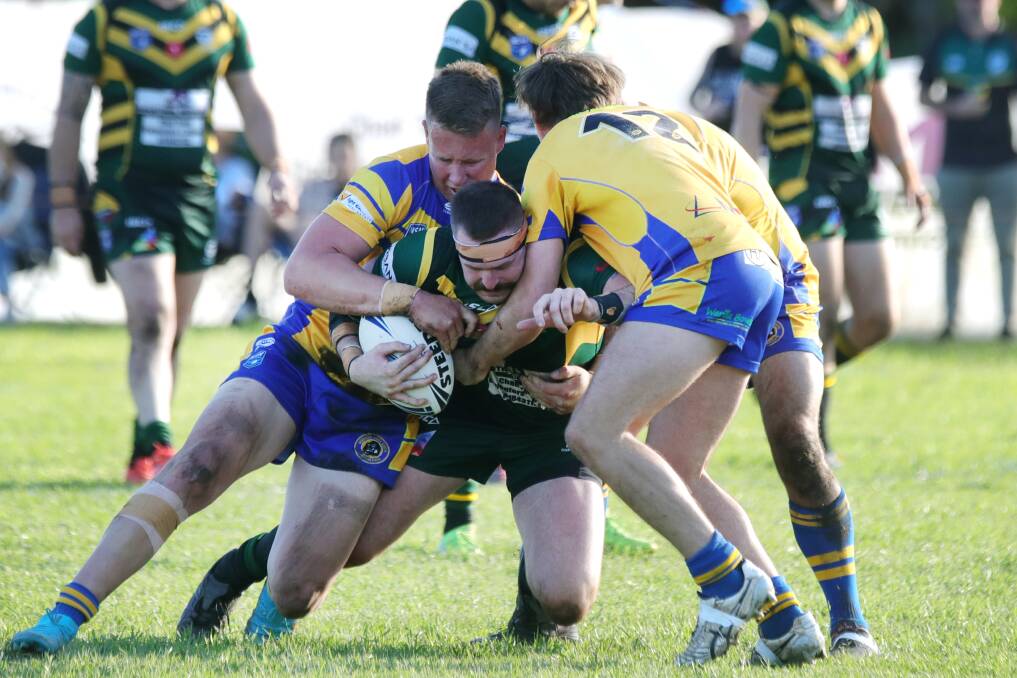 NEW RECRUIT: Tom Warner (being tackled) has been one of the Stingrays best players since joining the club from Albion Park this season. Picture: Sylvia Liber