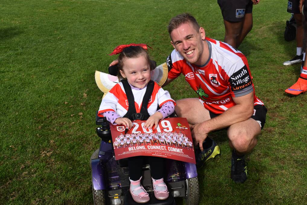 SUPPORT: The Dragons were joined at training on Monday by families who are supported by the Illawarra Community Foundation and i98FM Illawarra Convoy.